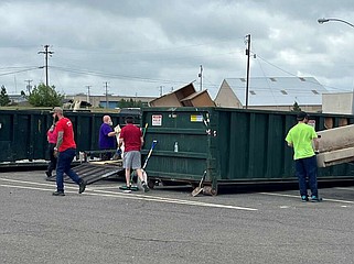 Residents discard unwanted items at a city dumpster location at an earlier Spring Fling event. (Photo courtesy of the city of Hot Springs)